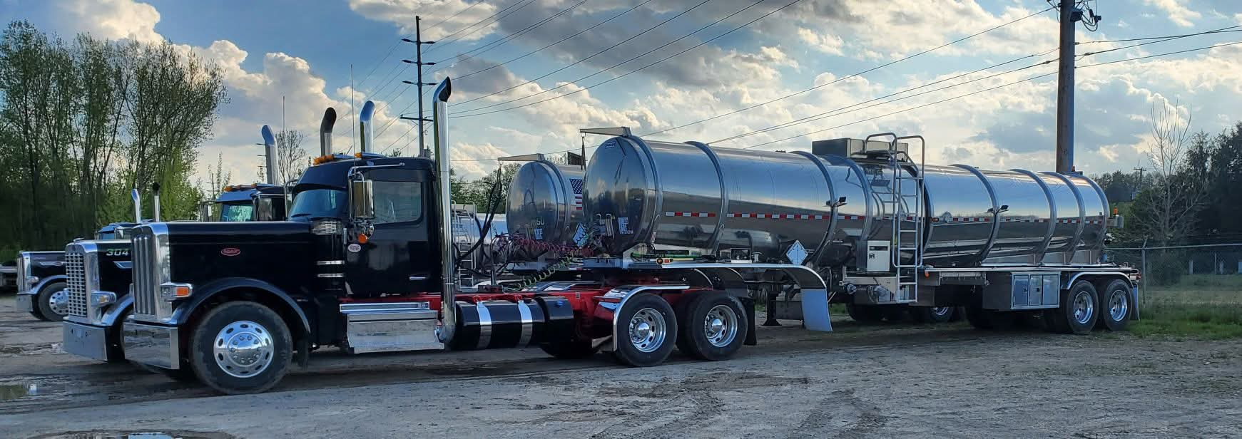 Titan Oil truck 304 with crude tanker at sunset
