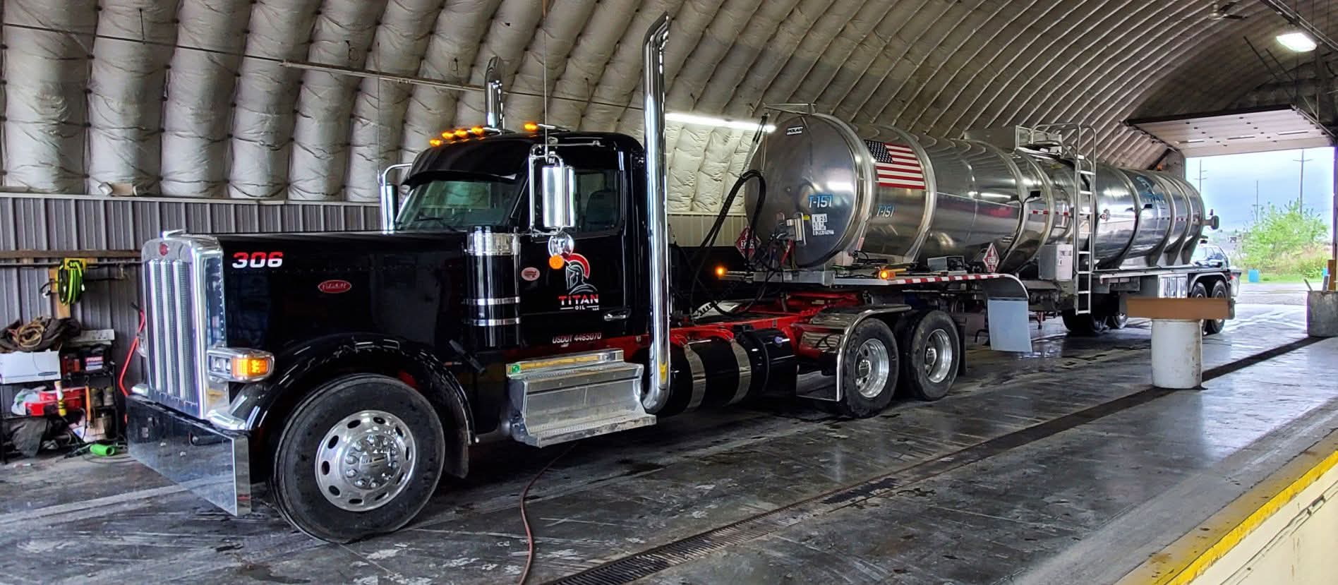 Titan Oil truck 306 hooked to a crude tanker in the wash bay